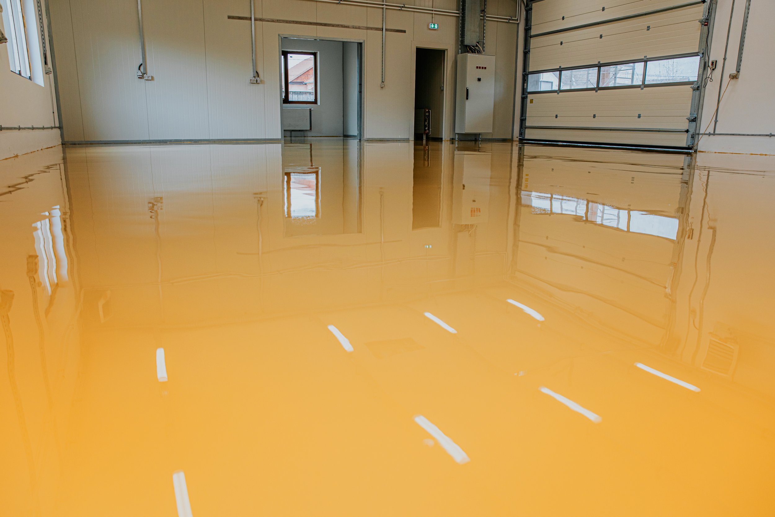 New epoxy floor in warehouse factory. Construction series